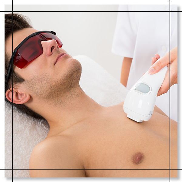 man getting laser hiar removal on his chest